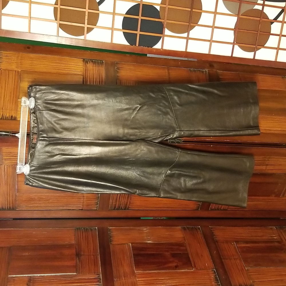 Black Italian leather boot cut pants by Danier size 12